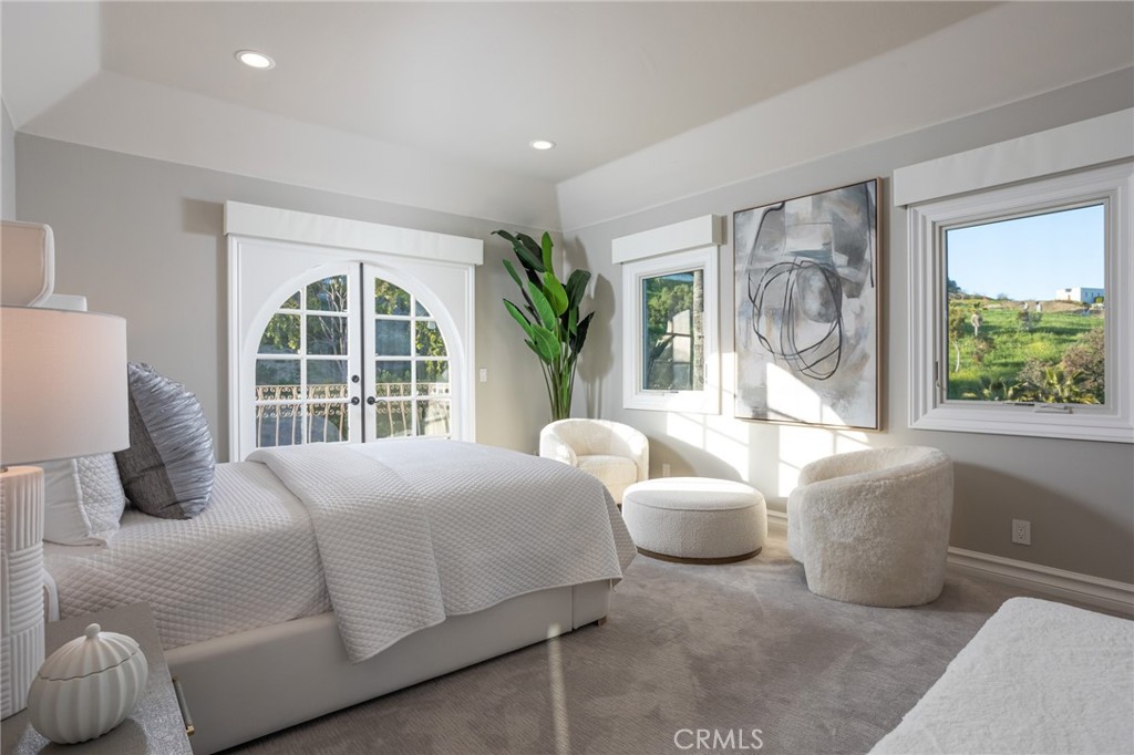 9 Wildflower Laguna Niguel, CA 92677 - Photo 27 of 47 a bedroom with a bed and a large window