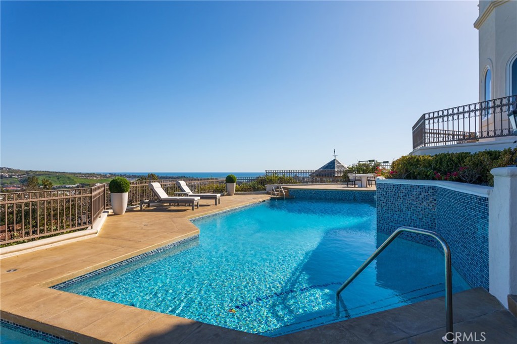 9 Wildflower Laguna Niguel, CA 92677 - Photo 36 of 47 a view of a swimming pool with a lounge chair