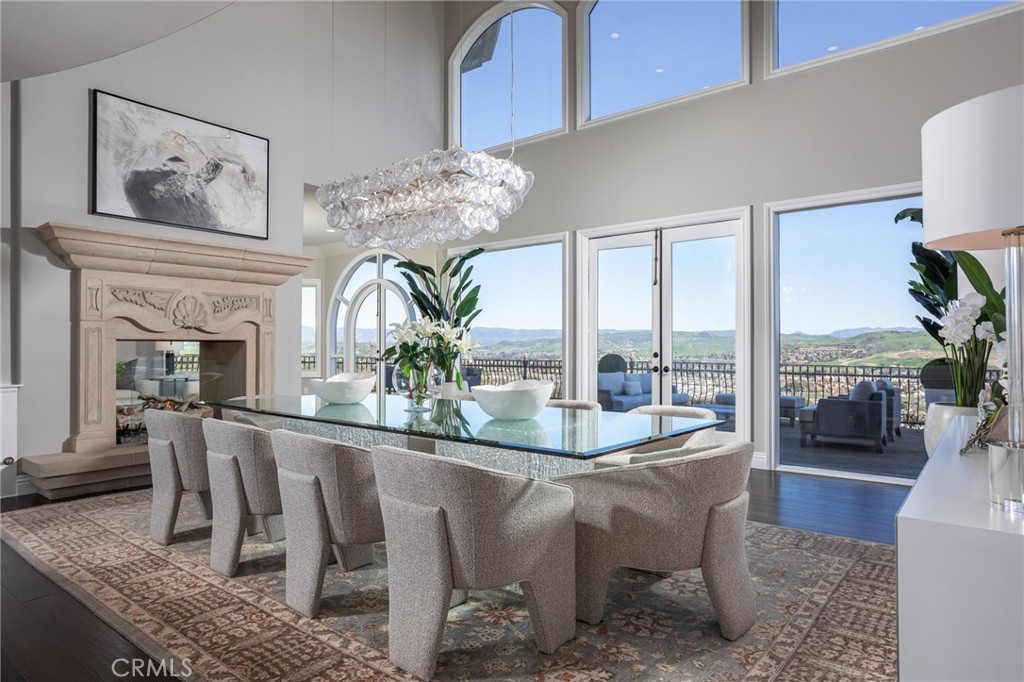 9 Wildflower Laguna Niguel, CA 92677 - Photo 9 of 47 a dining room with furniture a rug and a chandelier