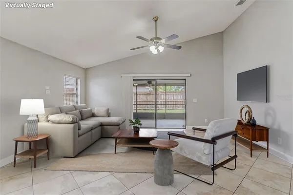 a living room with furniture and a large window