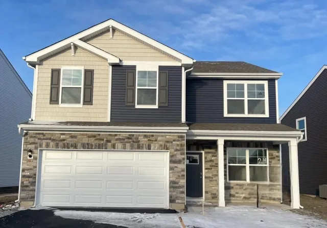 a front view of a house with a garage