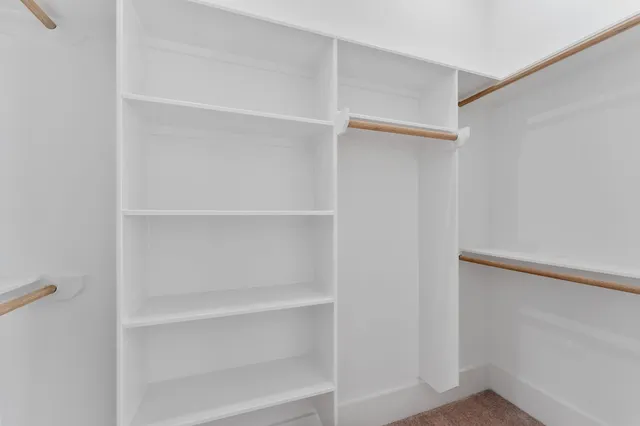 a view of an empty walk in closet