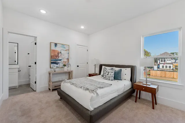 a bedroom with a bed and a table in it