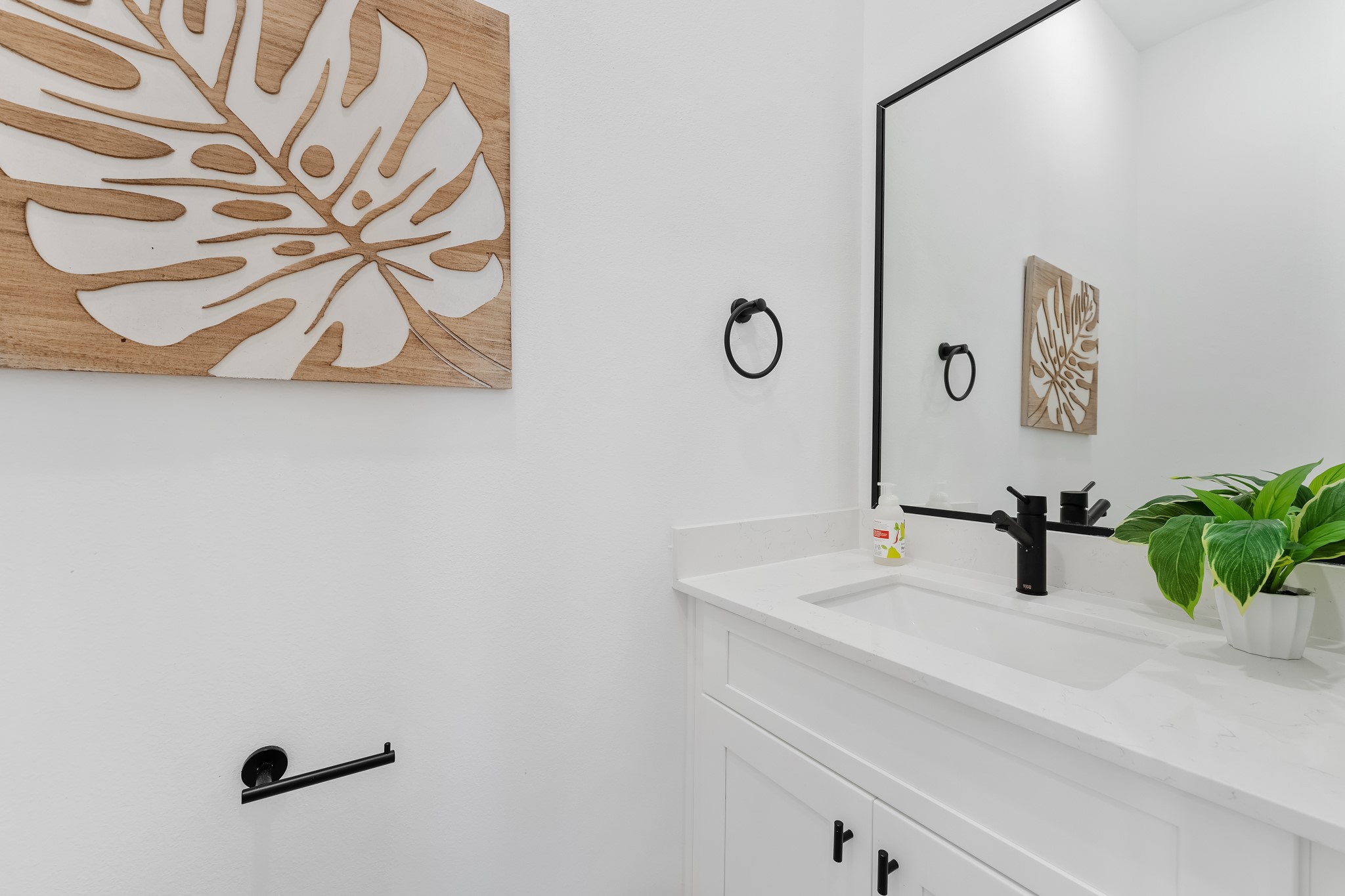 5630 Azores Houston, TX 77091 - Photo 7 of 33 a bathroom with a sink and a mirror