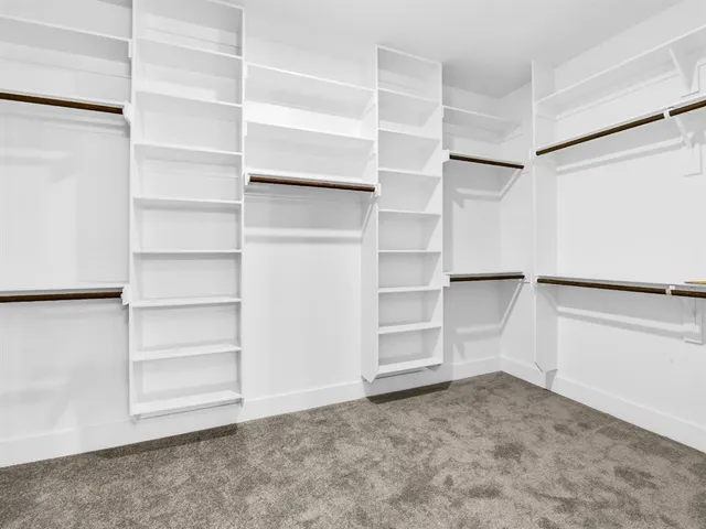 a view of an empty walk in closet