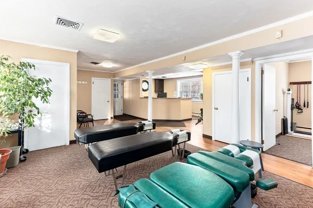 a bedroom with a bed window and couch