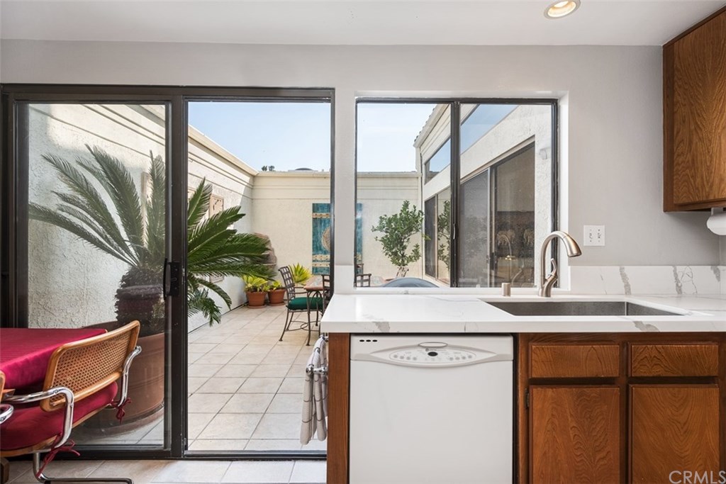 45 Morena Irvine, CA 92612 - Photo 13 of 49 Sliding door offers a second access point to your spacious private, tiled atrium to enjoy cocktails and conversations.