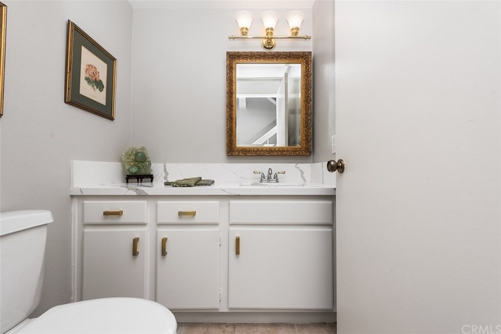 45 Morena Irvine, CA 92612 - Photo 23 of 49 Downstairs powder room with quartz countertop and new fixtures.