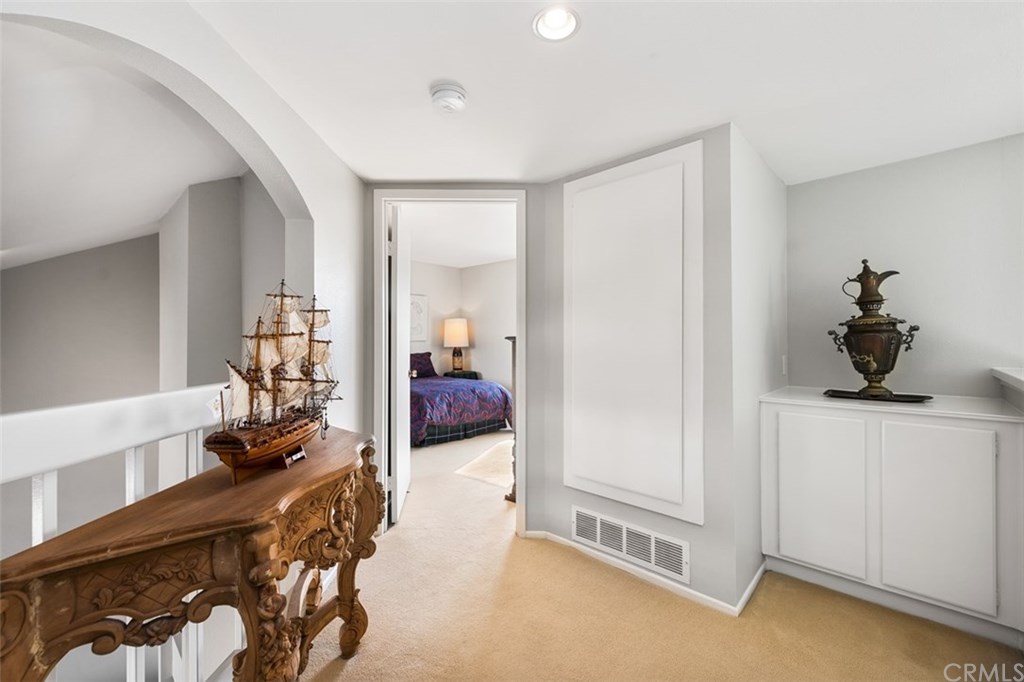 45 Morena Irvine, CA 92612 - Photo 30 of 49 The landings' view of the linen cabinet and a peak into the Second Bedroom En-suite bathroom.