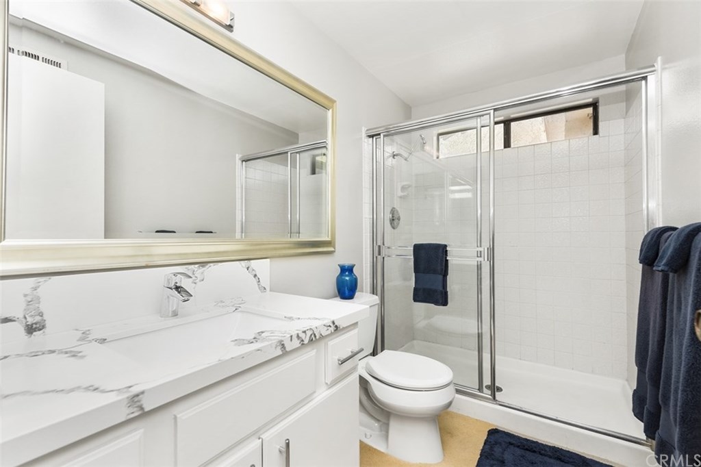 45 Morena Irvine, CA 92612 - Photo 34 of 49 Second En-Suite Bathroom, walk in shower, and new quartz counters, backsplash, and fixtures.