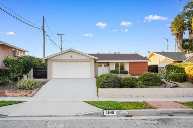 a front view of a house with garage