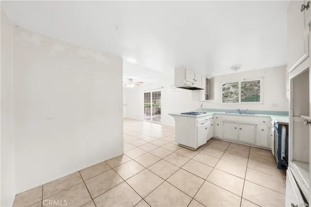a kitchen with a cabinets and window