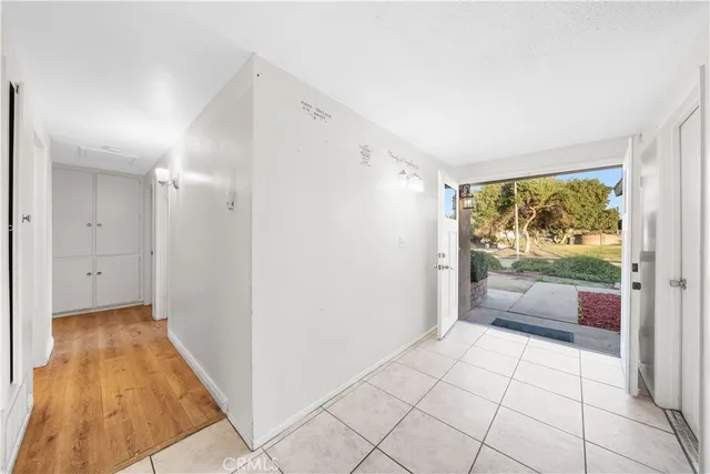 a view of an entryway with wooden floor and door