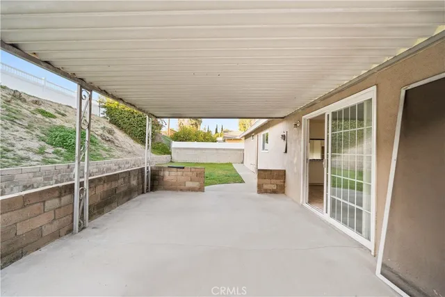 a view of an empty room with a fireplace