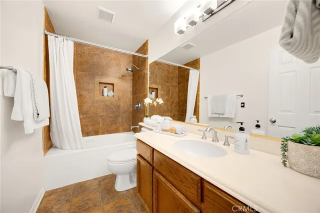 a bathroom with a sink double vanity and a shower