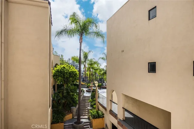 a front view of a house with fountain bath tub and fire pit