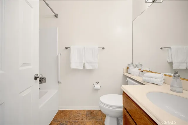 a en suite bathroom with a sink and a mirror