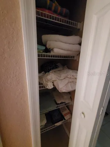 a bathroom with a double vanity sink a toilet and a mirror