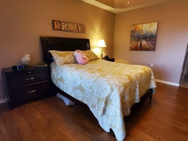 a living room with furniture a chandelier and a window