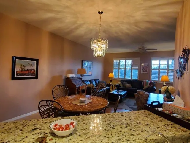 a front view of a building with a garden