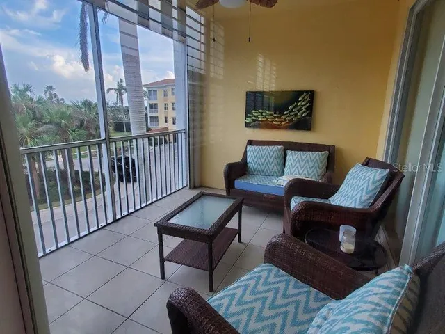 a view of a living room and a couch in a balcony