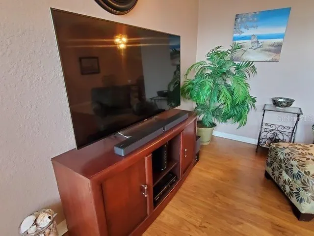 a kitchen with stainless steel appliances wooden cabinets and a stove top oven