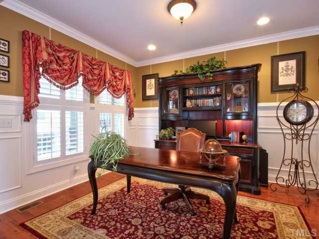 10149 Darling Street Raleigh, NC 27613 - Photo 2 of 25 The formal living room has hardwoods and high end custom molding. Living Room