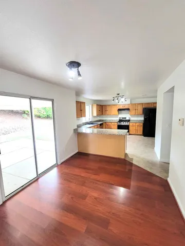 a view of a kitchen with a sink and a stove top oven