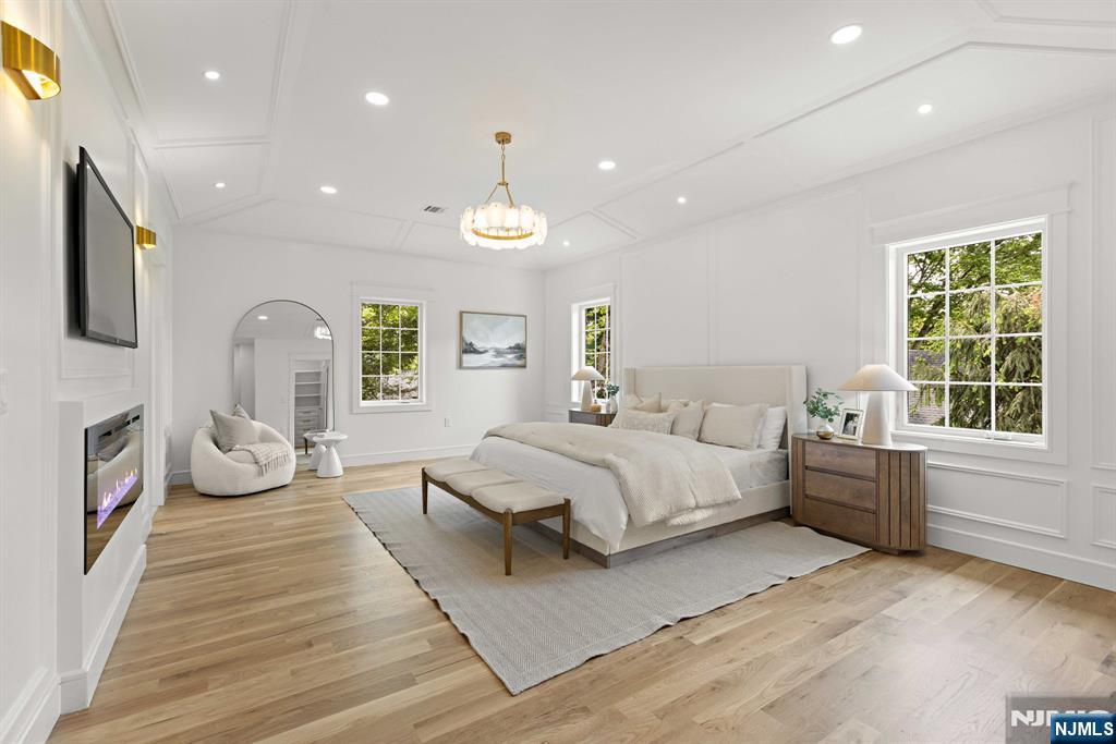 14 Beechwood Road Ho-Ho-Kus, NJ 07423 - Photo 10 of 31 a spacious bedroom with a large bed and windows