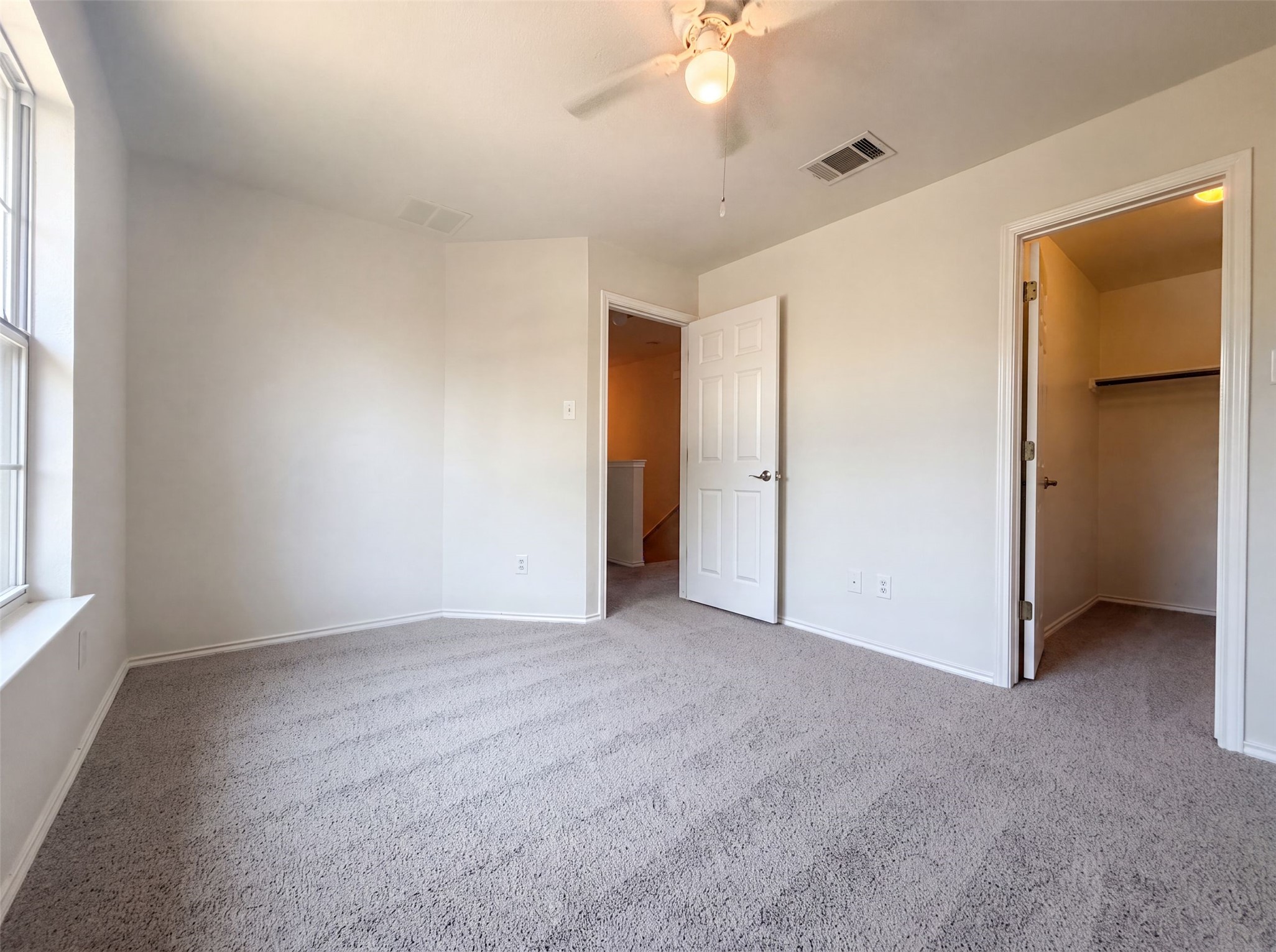 40 Verde Ranch Loop Leander, TX 78641 - Photo 11 of 20 A quiet bedroom offers plush carpet, abundant natural light, and convenient closet access.