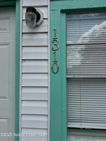 a view of a door and a window