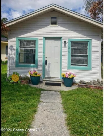 a view of a livingroom and window