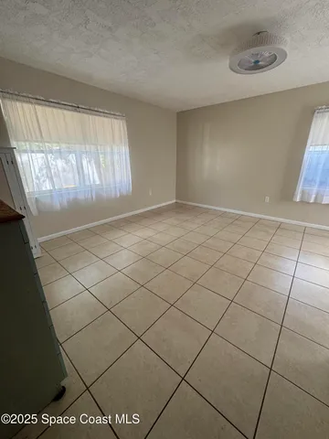 a view of a livingroom and window