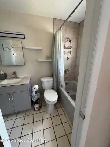 a bathroom with a toilet a sink and shower