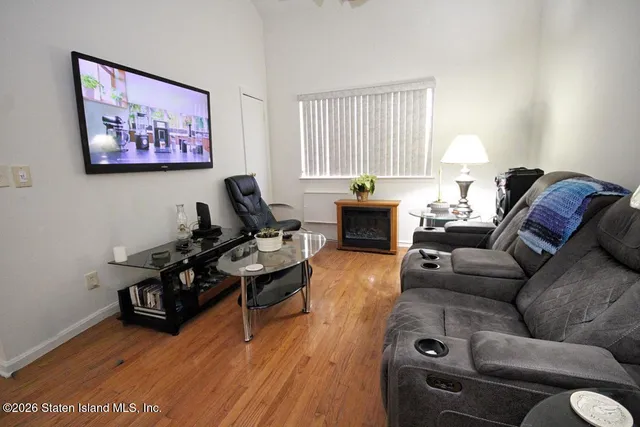 a living room with furniture rug and window