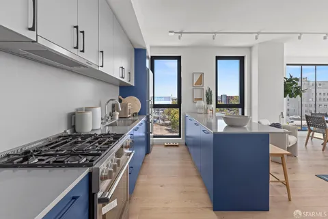 a kitchen with stainless steel appliances granite countertop a stove and a sink