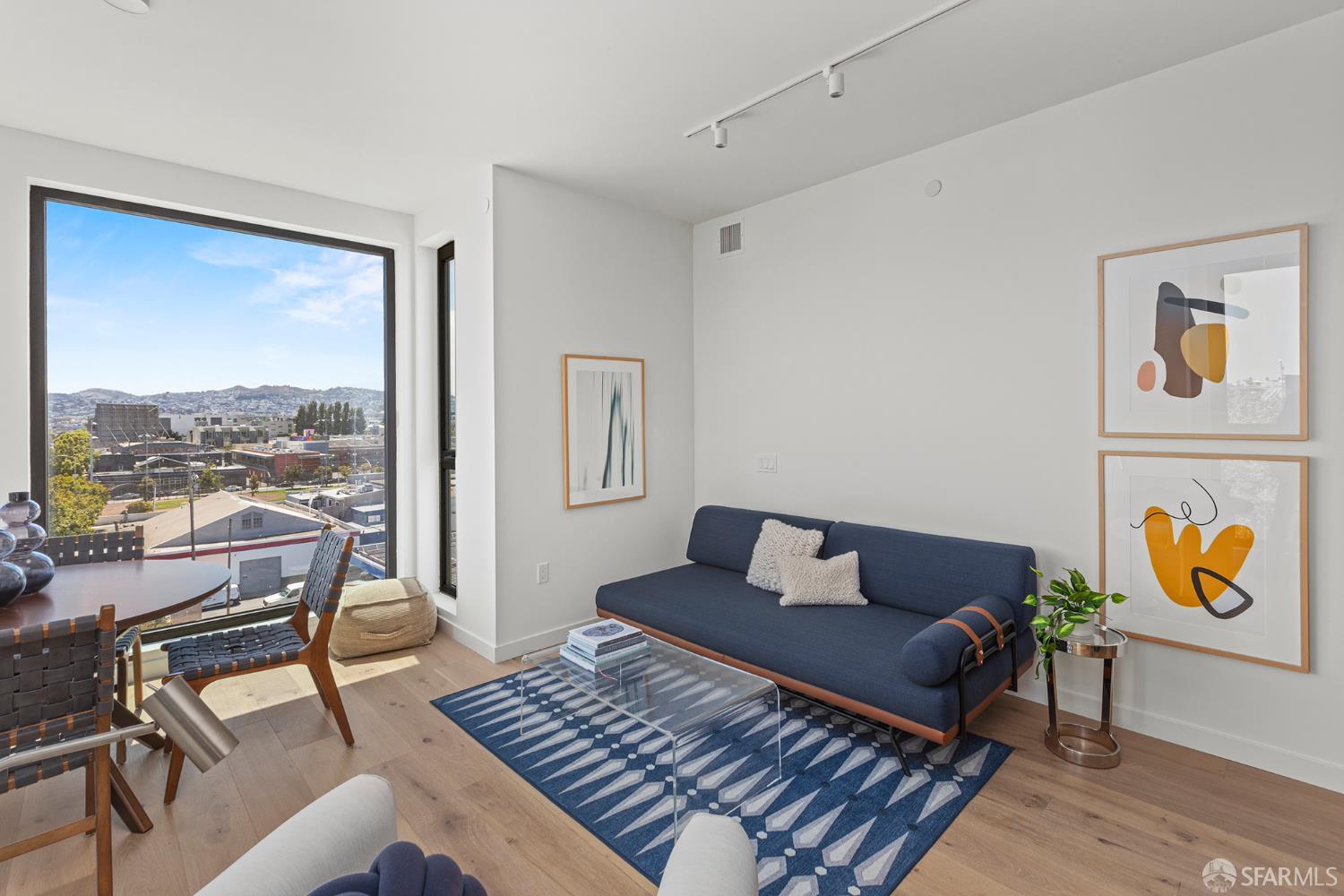 988 Harrison Street, Unit HM6 San Francisco, CA 94107 - Photo 6 of 14 a living room with furniture and a window