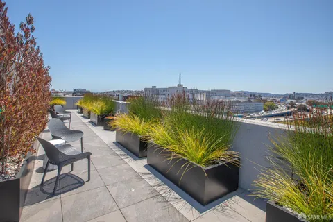 a view of a terrace with furniture and lake view