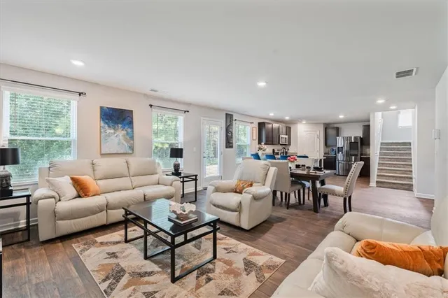 a living room with furniture and a large window