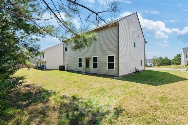 a view of a backyard of the house