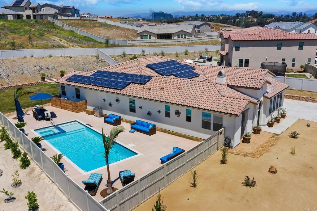 an aerial view of a house with a swimming pool