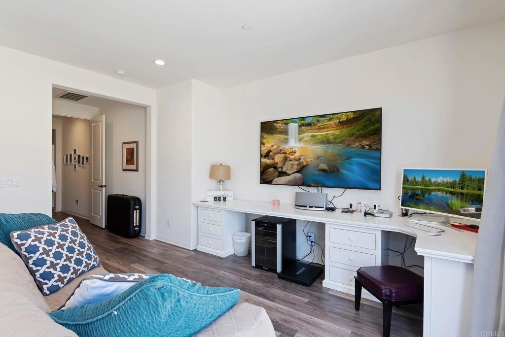 22089 Gallop Way Escondido, CA 92029 - Photo 18 of 43 a living room with fireplace furniture and a flat screen tv