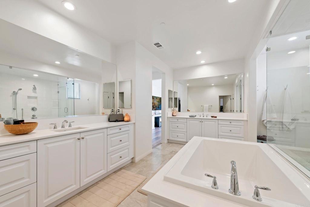 22089 Gallop Way Escondido, CA 92029 - Photo 19 of 43 a large white kitchen with a large window