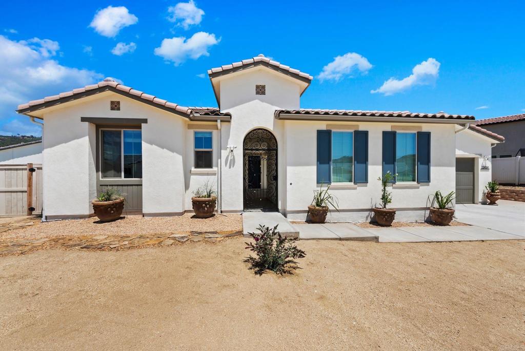 22089 Gallop Way Escondido, CA 92029 - Photo 2 of 43 a view of a house with a patio