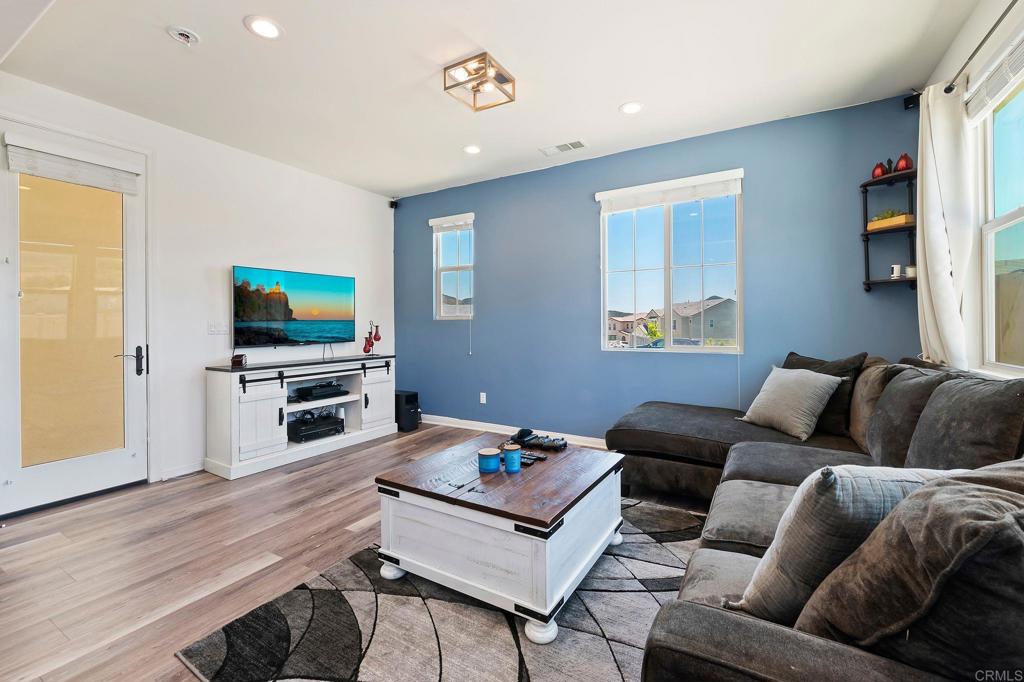 22089 Gallop Way Escondido, CA 92029 - Photo 25 of 43 a living room with furniture and a flat screen tv