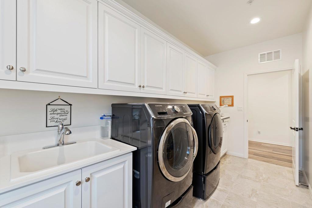 22089 Gallop Way Escondido, CA 92029 - Photo 28 of 43 a utility room with sink dryer and washer