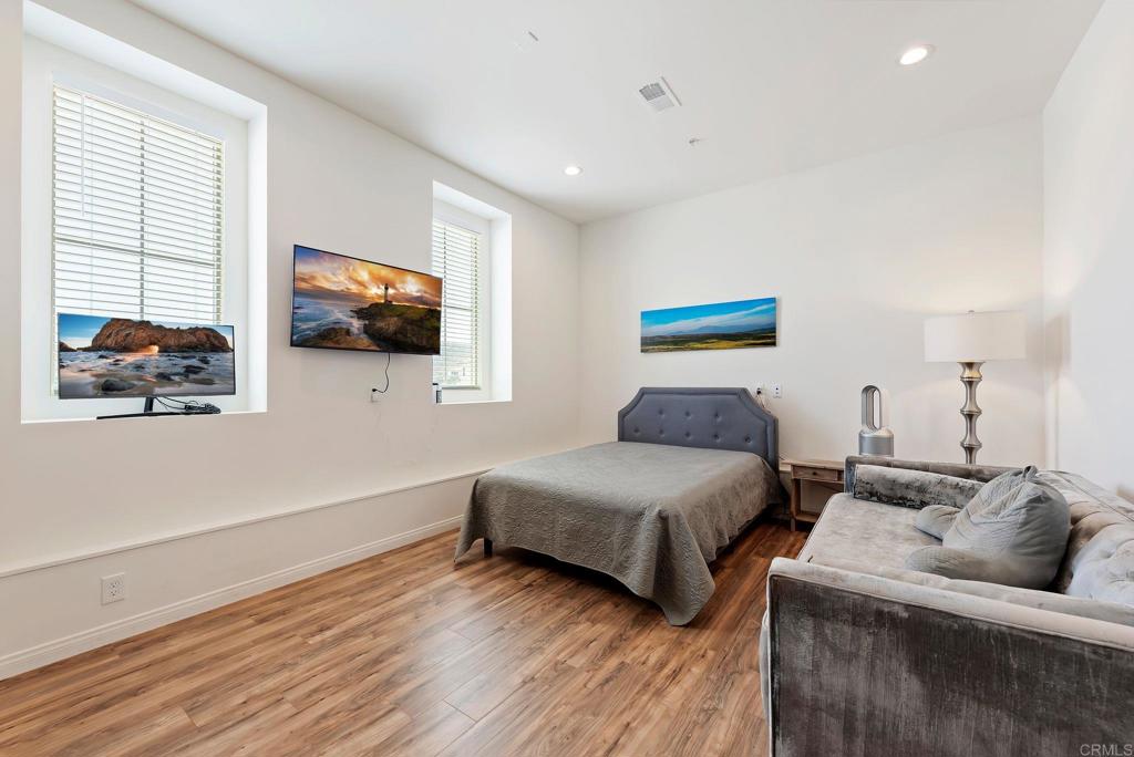 22089 Gallop Way Escondido, CA 92029 - Photo 30 of 43 a bedroom with two beds and a flat screen tv