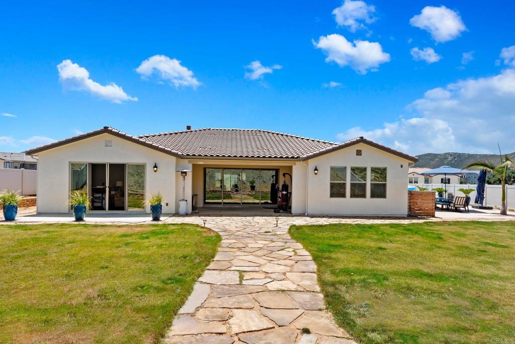 22089 Gallop Way Escondido, CA 92029 - Photo 33 of 43 a front view of a house with a yard