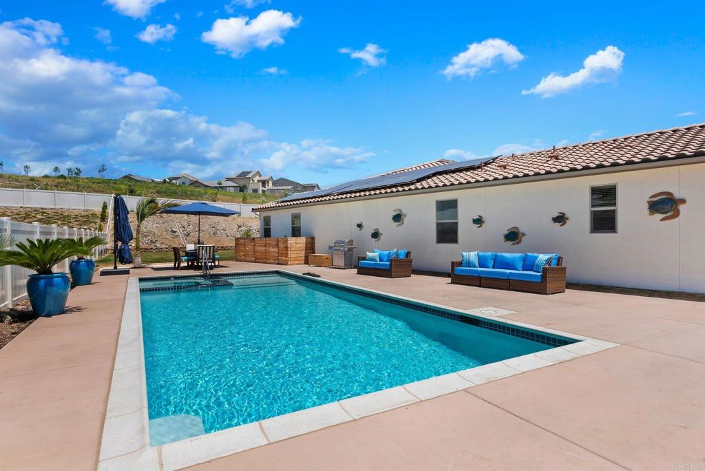 22089 Gallop Way Escondido, CA 92029 - Photo 35 of 43 a view of a terrace with a swimming pool