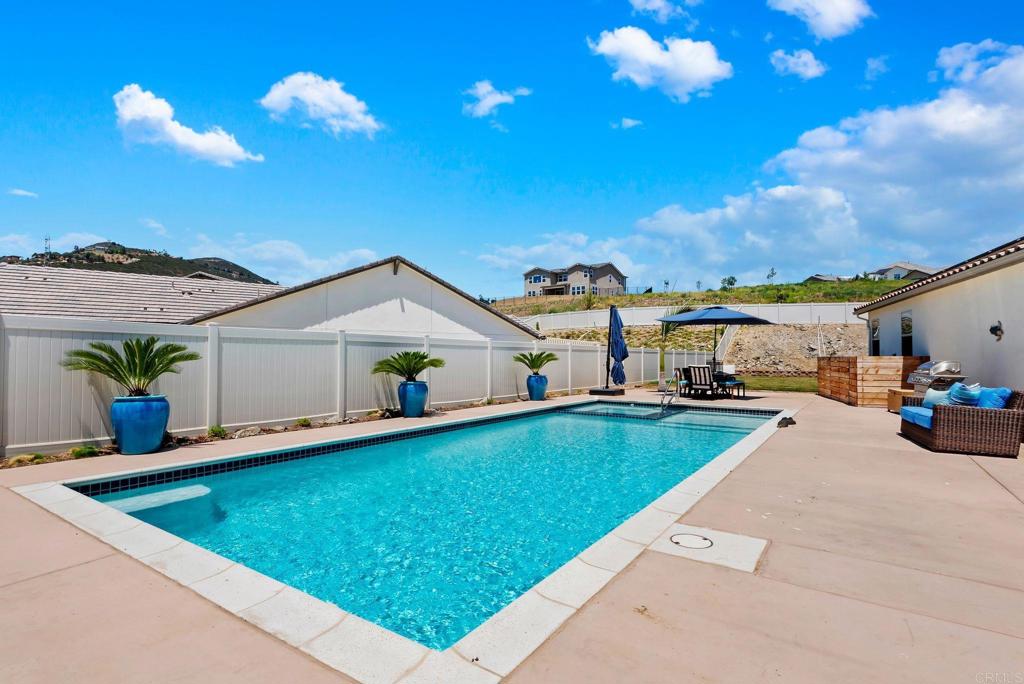 22089 Gallop Way Escondido, CA 92029 - Photo 36 of 43 a view of a house with pool and chairs